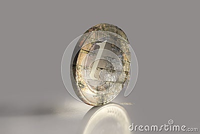 Crumbling euro coin Stock Photo