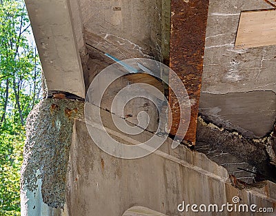 Crumbling infrastructure under a bridge Stock Photo