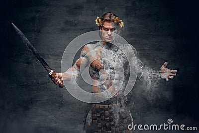 Ancient male athletic warrior with sword. Stock Photo