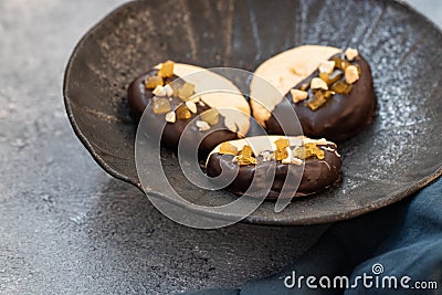 Crumbly vanilla-chocolate homemade cashew cookies and mango marmalade on a light beige background. natural sweets. cozy Stock Photo