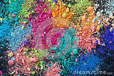 Crumbs of multi-colored chalk on a black background. Joy, Carnival. Panorama. A game for children. Art Stock Photo