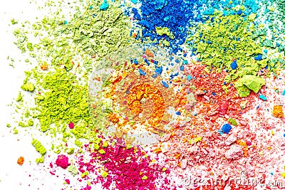 Crumbs of multi-colored chalk on a white background. Joy, Carnival. A game for children. Art Stock Photo