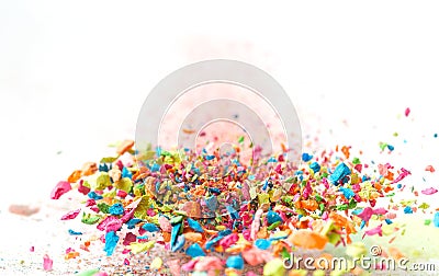 Crumbs of a multicolored chalk fly on a white background. Joy, Carnival. Panorama. Game for children Stock Photo