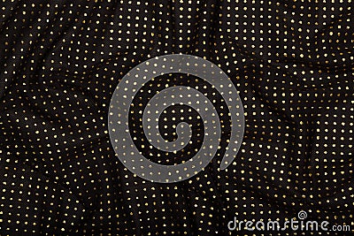 Crumpled black fabric with golden metallic dots Stock Photo