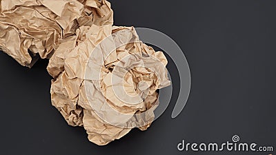 Crumpled brown paper.It is mauled on black background Stock Photo