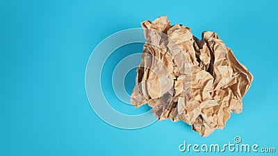 Crumpled brown paper.It is mauled on blue background Stock Photo