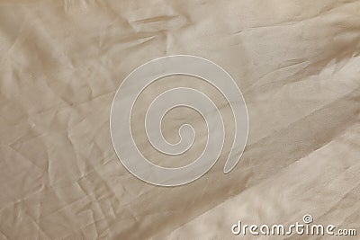 Crumpled dark beige fabric as background, top view Stock Photo