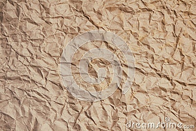 Crumpled light brown craft paper texture background. Package wrapping. Old wrapping paper. Baking parchment. Letter template. Stock Photo