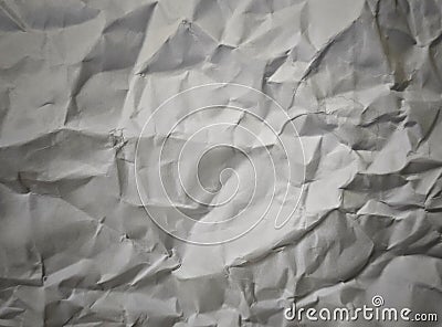 Crumpled paper background with soft light used to advertising template background. Stock Photo