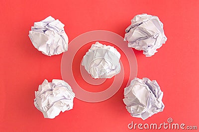 Crumpled paper balls on red background Stock Photo