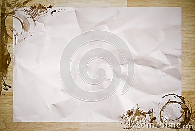 Crumpled paper with coffee stained on wood Stock Photo