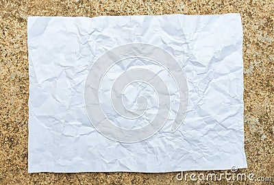 Crumpled paper placed on cement Stock Photo