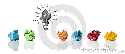 Crumpled paper symbolizing different ideas with one highlighted as a faulty one Stock Photo