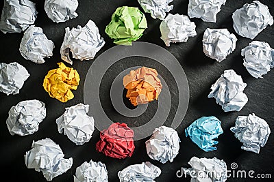 Crumpled paper symbolizing different solutions with some standing out Stock Photo