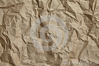 Crumpled paper, texture, background. Brown craft paper with wrinkled pattern Stock Photo