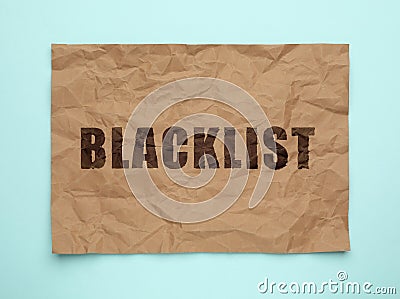 Crumpled paper with word Blacklist on light blue background, top view Stock Photo