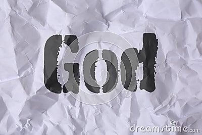 Crumpled paper with word God as background, top view Stock Photo