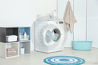 Crumpled towels in washing machine at home Stock Photo