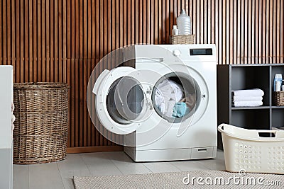 Crumpled towels in washing machine at home. Laundry room Stock Photo