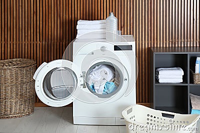 Crumpled towels in washing machine at home. Laundry room Stock Photo