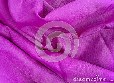 crumpled and wavy surface texture of bright pink cotton cloth. Stock Photo
