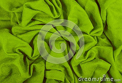 A crumpled woolen cloth. Woolen Indian Shawl. Green background of crumpled tissue Stock Photo