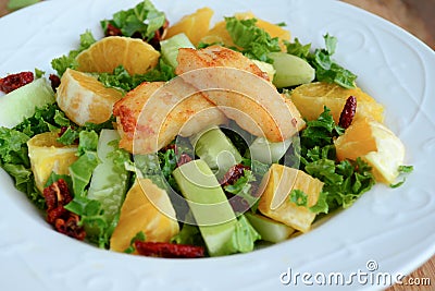 Crunchy green salad with pecans ,sweet lime and fish Stock Photo