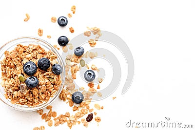 Crunchy muesli and blueberry Breakfast cereals isolated on white background, selective focus, top view Stock Photo