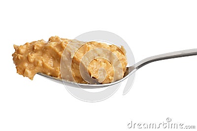 Crunchy peanut butter on metal spoon Stock Photo