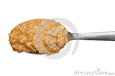 Crunchy peanut butter on metal spoon Stock Photo