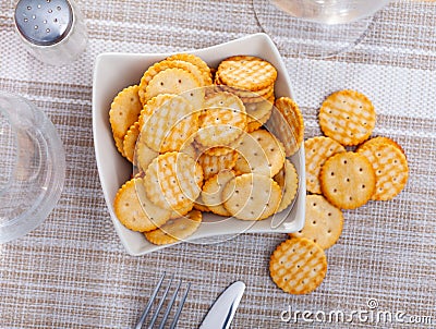 Portion of round crackers served in bowl Stock Photo