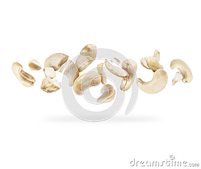 Crushed cashew nuts close-up hovered in white space Stock Photo