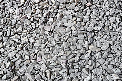 Crushed rock close up. Small rocks ground. Crushed stone road building material gravel texture. Small stone construction material Stock Photo