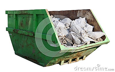 Crushed rusty green container filled with construction debris Stock Photo