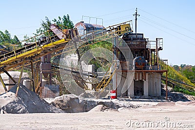 Crushing machinery, cone type rock crusher, conveying crushed gr Stock Photo