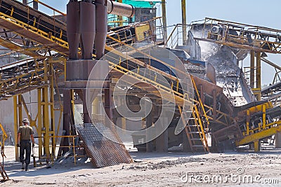 Crushing machinery, cone type rock crusher, conveying crushed gr Editorial Stock Photo