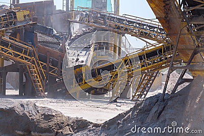 Crushing machinery, cone type rock crusher, conveying crushed gr Stock Photo