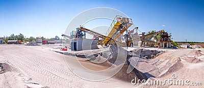 Crushing machinery, cone type rock crusher, conveying crushed gr Stock Photo