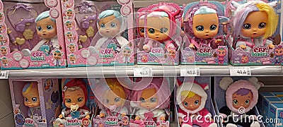 Cry baby doll for sale in a supermarket Editorial Stock Photo
