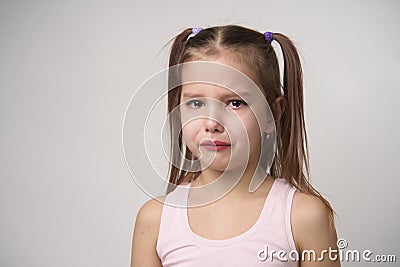 Crying child girl against white background Stock Photo