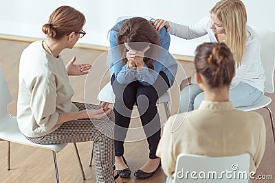 Crying during group therapy Stock Photo