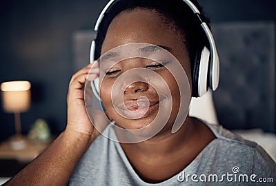 Crying, happy and black woman with headphones for music, sound or audio. Tears, radio and plus size African person Stock Photo