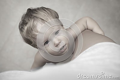 Crying little child asking mom for shelter and comfort. Stock Photo