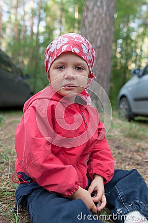 Crying little girl in forest Stock Photo