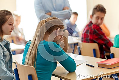 Crying student girl with test result and teacher Stock Photo