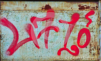 Cryptic Red Graffiti on Rusted Metal Sheet Stock Photo