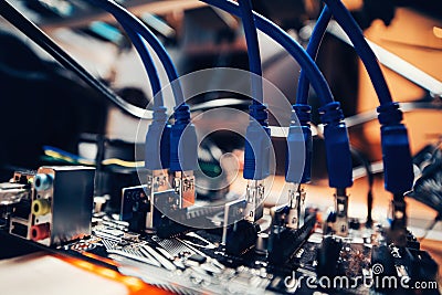 Cryptocurrency mining rig technological details. Graphics cards inserted into motherboard Stock Photo