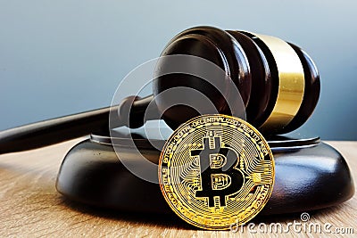 Crypto regulation. Gavel and cryptocurrency BTC Bitcoin. Stock Photo