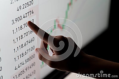Crypto trader investor analyst looking at computer screen analyzing financial graph data on pc Stock Photo