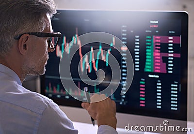 Crypto trader investor using computer analyzing cryptocurrency stock market. Stock Photo